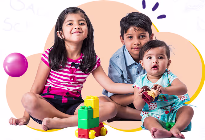 Children sitting and playing with blocks